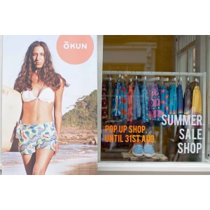 White Wooden Clothes Hangers, Printed With Logo - Okun Africa. Beach. Wear.